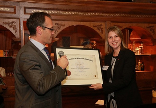 Dena Rantz FICS, of Teekay receives her Institute of Chartered Shipbrokers certificate frome Peter Amat of Pacific Basin